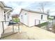A detached one-car garage sits on a concrete pad, surrounded by a chain link fence at 810 W 2Nd St, Anderson, IN 46016