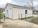 A detached one-car garage sits on a concrete pad, surrounded by a chain link fence at 810 W 2Nd St, Anderson, IN 46016