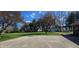 Large backyard with a spacious lawn, mature trees, and a shed for extra storage at 965 W New Rd, Greenfield, IN 46140