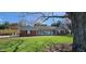 Inviting single-story home with brick and siding accents, complemented by a lush green lawn at 965 W New Rd, Greenfield, IN 46140
