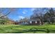 Charming single-story home with a well-maintained lawn and inviting front porch at 965 W New Rd, Greenfield, IN 46140