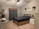 Cozy bedroom with a metal bed frame and neutral decor at 9820 Legends Creek Dr # 208, Indianapolis, IN 46229