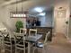 Open concept kitchen and dining area with modern appliances and breakfast bar at 9820 Legends Creek Dr # 208, Indianapolis, IN 46229