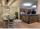 Open concept kitchen and dining area with modern appliances and breakfast bar at 9820 Legends Creek Dr # 208, Indianapolis, IN 46229