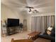 Relaxing living room with a large TV and comfy seating at 9820 Legends Creek Dr # 208, Indianapolis, IN 46229