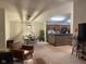 Open living area features a comfortable armchair and coffee table at 9820 Legends Creek Dr # 208, Indianapolis, IN 46229
