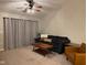 Living room features a large sectional sofa and sliding glass doors at 9820 Legends Creek Dr # 208, Indianapolis, IN 46229