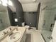 Stylish bathroom with a glass shower, vanity, and elegant design at 11720 Grenadier Ln, Indianapolis, IN 46229