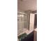 Modern bathroom featuring a glass-enclosed shower, tile, and contemporary fixtures at 11720 Grenadier Ln, Indianapolis, IN 46229