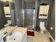 Modern bathroom with a glass-enclosed shower, vanity, and neutral color scheme at 11720 Grenadier Ln, Indianapolis, IN 46229
