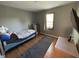 Comfortable bedroom featuring wood floors, natural light, and cozy decor at 11720 Grenadier Ln, Indianapolis, IN 46229