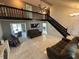 Bright open living space with lofted area and staircase access, perfect for entertaining at 11720 Grenadier Ln, Indianapolis, IN 46229