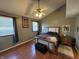 Comfortable main bedroom with a vaulted ceiling, ceiling fan, and hardwood floors at 11720 Grenadier Ln, Indianapolis, IN 46229
