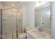 Bathroom with shower, white fixtures, and a white vanity with a hard surface countertop at 6596 Dogwood Dr, McCordsville, IN 46055
