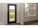 Bright entryway showcasing a modern door and a window offering natural light at 6596 Dogwood Dr, McCordsville, IN 46055