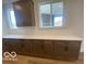 Spacious kitchen features sleek quartz countertops and ample cabinets for storage at 6596 Dogwood Dr, McCordsville, IN 46055