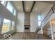 Spacious living room with high ceilings and fireplace at 6596 Dogwood Dr, McCordsville, IN 46055