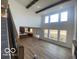 Bright, open-concept living room with high ceilings and natural light at 6596 Dogwood Dr, McCordsville, IN 46055