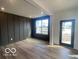 Modern living room with striking accent wall and ample natural light at 6596 Dogwood Dr, McCordsville, IN 46055