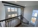 Bright living room boasts large windows and stone fireplace at 6596 Dogwood Dr, McCordsville, IN 46055