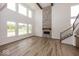 Bright and airy living room with a stone fireplace and soaring ceilings at 6596 Dogwood Dr, McCordsville, IN 46055