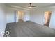 Large main bedroom with ceiling fan and ensuite bathroom at 6596 Dogwood Dr, McCordsville, IN 46055