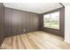 Elegant room featuring striking millwork, wood floors, and a bright, large window at 6596 Dogwood Dr, McCordsville, IN 46055