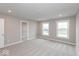 A spacious bedroom with closet and windows providing natural light, carpet flooring and neutral walls at 7340 W County Road 600 Rd, McCordsville, IN 46055