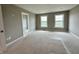 Neutral bedroom with two windows and doorway at 7340 W County Road 600 Rd, McCordsville, IN 46055