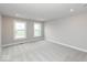 A cozy bedroom with neutral carpet, recessed lighting, and windows that offer pleasant views at 7340 W County Road 600 Rd, McCordsville, IN 46055
