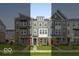 Charming townhomes with colorful doors and well-maintained lawns in a friendly neighborhood setting at 7340 W County Road 600 Rd, McCordsville, IN 46055