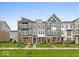 Charming townhomes with colorful doors and well-maintained lawns in a friendly neighborhood setting at 7340 W County Road 600 Rd, McCordsville, IN 46055