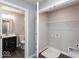 Small laundry room with washer dryer hookups, wire shelving, and the door to the bathroom is open at 7340 W County Road 600 Rd, McCordsville, IN 46055