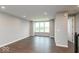 A modern living room with hardwood floors, recessed lighting, and large windows that provide natural light at 7340 W County Road 600 Rd, McCordsville, IN 46055