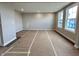 Spacious living room with large windows allowing plenty of natural light, and light walls at 7340 W County Road 600 Rd, McCordsville, IN 46055