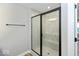 Bathroom featuring a stand up shower, tile walls, and a sleek black frame at 7344 W County Road 600, McCordsville, IN 46055