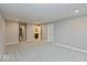 Spacious bedroom featuring plush carpet, neutral walls, and access to a bathroom and walk-in closet at 7344 W County Road 600, McCordsville, IN 46055