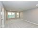 Bedroom with neutral carpet, light gray walls, and large windows offering abundant natural light at 7344 W County Road 600, McCordsville, IN 46055