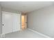 A bedroom with gray walls, white trim, and sliding closet doors at 7344 W County Road 600, McCordsville, IN 46055