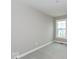 A bedroom with gray walls, carpeted floor, and a window at 7344 W County Road 600, McCordsville, IN 46055