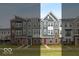Modern townhome exterior showcasing varied architectural styles and vibrant, colorful front doors at 7344 W County Road 600, McCordsville, IN 46055