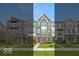 Attractive townhomes featuring varied facades, professionally landscaped lawns and welcoming entrance doors at 7344 W County Road 600, McCordsville, IN 46055