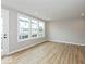 This living room is filled with natural light from large windows and features neutral paint and recessed lighting at 7344 W County Road 600, McCordsville, IN 46055