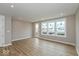 Bright living room featuring recessed lighting and large windows overlooking the outdoor space at 7344 W County Road 600, McCordsville, IN 46055