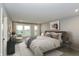 Serene main bedroom features a plush bed, soft lighting, and a tranquil atmosphere for relaxation at 7344 W County Road 600, McCordsville, IN 46055