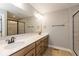 Luxurious bathroom with a double vanity, modern fixtures, and a glass-enclosed shower at 7348 W County Road 600 Rd # 12-604, McCordsville, IN 46055