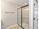 Elegant shower with white tiled walls and a seating bench inside the walk in shower at 7348 W County Road 600 Rd # 12-604, McCordsville, IN 46055