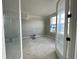 Bright bedroom with large windows, painted in neutral colors, visible through glass french doors at 7348 W County Road 600 Rd # 12-604, McCordsville, IN 46055