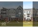 View of several new townhomes, with brick accents and various siding colors at 7348 W County Road 600 Rd # 12-604, McCordsville, IN 46055