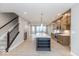 Open concept kitchen features a central island and stainless steel appliances at 7348 W County Road 600 Rd # 12-604, McCordsville, IN 46055
